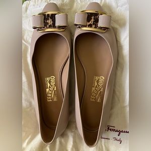 Ferragamo beige low pumps with mohair accent on now.